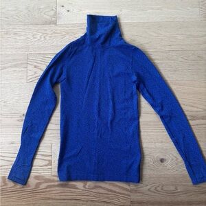 Athleta. Blue Turtleneck with black print. Great for layering or activewear.